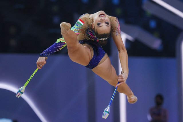 Rhythmic gymnast Szofia Bernat of Hungary performs her clubs routine during the individual all-around event at the Divine Grace International Experimental Rhythmic Gymnastics Tournament, at VTB Arena in Moscow, Russia on December 17, 2021. (Photo by Gavriil Grigorov/TASS)