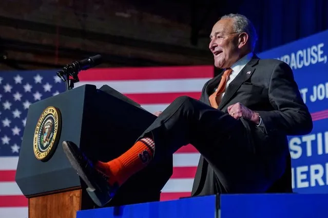 U.S. Senate Majority Leader Chuck Schumer (D-NY) shows off his Syracuse University orange socks at the Milton J. Rubenstein Museum of Science and Technology, in Syracuse, New York, on April 25, 2024. (Photo by Kevin Lamarque/Reuters)