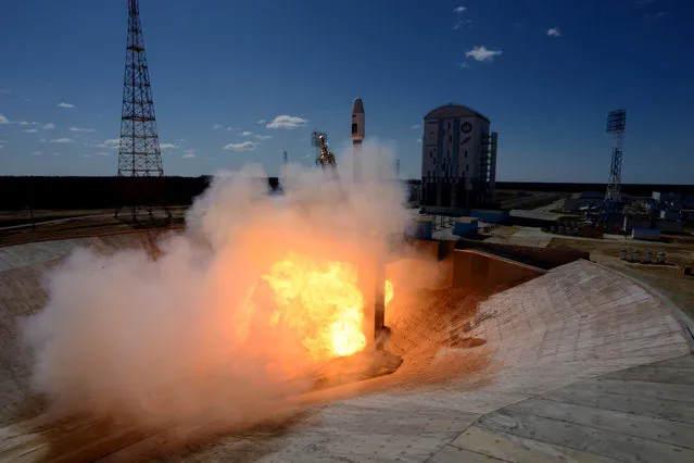 A Russian Soyuz 2.1a rocket carrying Lomonosov, Aist-2D and SamSat-218 satellites lifts off from the launch pad at the new Vostochny Cosmodrome outside the city of Uglegorsk, about 200 kilometers (125 miles) from the city of Blagoveshchensk in the far eastern Amur region Thursday, April 28, 2016. (Photo by Kirill Kudryavtsev/Pool Photo via AP Photo)