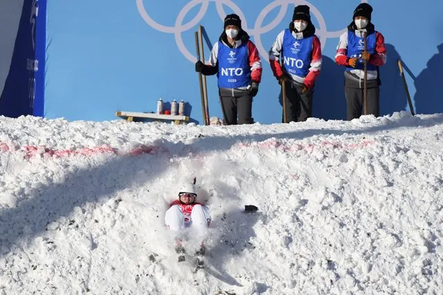 China's Shao Qi falls as she competes during the women's aerials qualification at the 2022 Winter Olympics, Monday, February 14, 2022, in Zhangjiakou, China. (Photo by Lee Jin-man/AP Photo)
