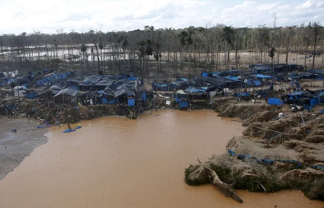 A view of an illegal gold mining camp in a zone known as Mega 14, in the southern Amazon region of Madre de Dios July 14, 2015. (Photo by Janine Costa/Reuters)