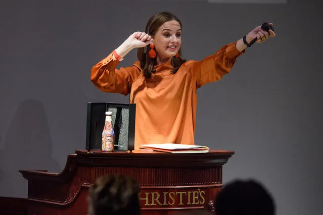 Auctioneer Arlene Blankers sells a specially created Ed Sheeran X Heinz Tomato Ketchup, Tattoo Edition bottle for £1500, in a charity auction at Christie’s Auction House in London, England on August 15, 2019. (Photo by Matt Crossick/PA Wire Press Association)