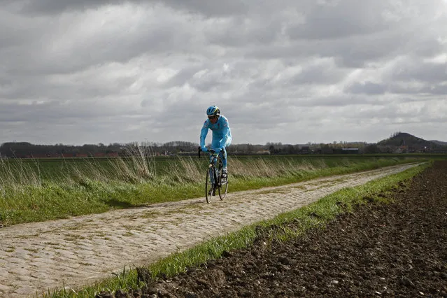 An Astana team cyclist trains ahead of Sunday's 114th edition of the Paris-Roubaix cycling classic, in Haveluy, northern France, Thursday, April 7, 2016. (Photo by Michel Spingler/AP Photo)