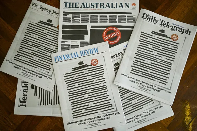 Front pages of major Australian newspapers show a “Your right to know” campaign, in Canberra, Australia, October 21, 2019. Australia's biggest newspapers ran front pages on Monday made up to appear heavily redacted to protest against recent legislation that restricts press freedoms, a rare show of unity by the usually tribal media industry. (Photo by Lukas Coch/AAP Image via Reuters)