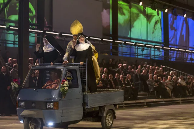 Artists perform during the opening show directed by German director Volker Hesse, on the opening day of the Gotthard rail tunnel, the longest tunnel in the world, at the fairground in Pollegio, Switzerland, Switzerland, 01 June 2016. The construction of the 57 kilometer long tunnel began in 1999, the breakthrough was in 2010. After the official opening on 01 June, the commercial opperation will commence on December 2016. (Photo by Alexandra Wey/EPA)