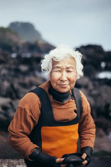 “The Windy Women of Jeju”. I had recently travelled to the island of Jejudo. During my stay there, I grew more interested in the elder women on the island. Many of these women (as old as 70-80+) would dive in the rough Pacific, and dive for 6 hours to forage for seaweed, sea cucumber, squid and other sea creatures to eat & sell. My conversations with them were the most memorable moments and hope to return to capture more of their daily lives. Photo location: Korea. (Photo and caption by Angie Choi/National Geographic Photo Contest)