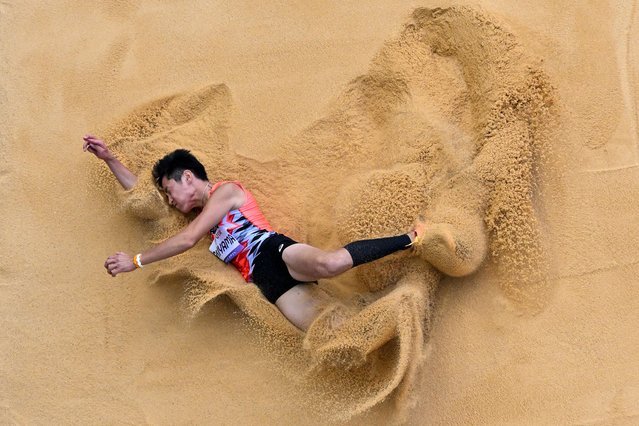 An overview shows Japan's Daiki Ishiyama competing in the athletics men's long jump T12 final during the Paris 2024 Paralympic Games at the Stade de France in Saint-Denis, north of Paris, on september 2, 2024. (Photo by Martin Bureau/AFP Photo)