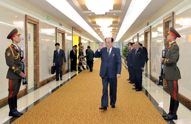 Kim Yong Nam (C), president of North Korea's Presidium of the Supreme People's Assembly, gestures as he departs for Egypt to take part in an opening ceremony of the New Suez Canal at the invitation of Egyptian President Abdel Fattah al-Sisi, in this undated photo released by North Korea's Korean Central News Agency (KCNA) in Pyongyang August 4, 2015. (Photo by Reuters/KCNA)