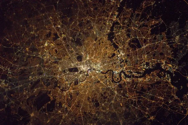 “London midnight Saturday – I'd rather be up here...but only just!! #toughcall”, said astronaut Tim Peake in the caption of this photo of London at night. (Photo by Tim Peake/ESA/NASA)