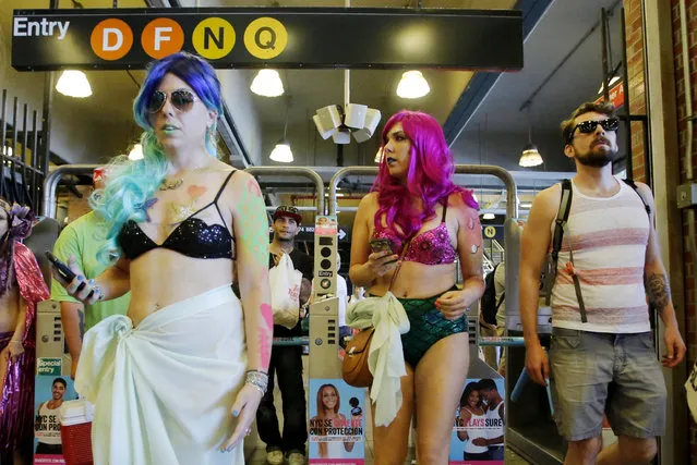 Participants of the Mermaid Parade arrive in a subway station in Brooklyn, New York June 18, 2016. (Photo by Eduardo Munoz/Reuters)