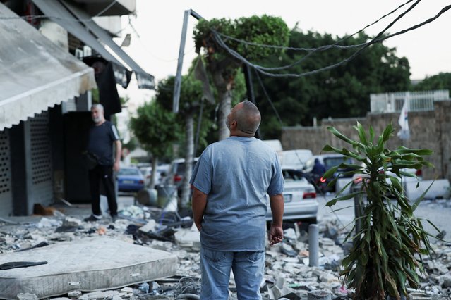 A man looks while standing at the site of an Israeli strike on central Beirut's Bachoura neighbourhood, amid ongoing hostilities between Hezbollah and Israeli forces, in Beirut, Lebanon on October 3, 2024. (Photo by Emilie Madi/Reuters)