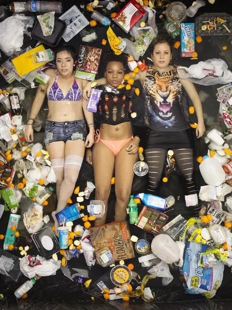 Lya, Whitney and Kathrin surrounded by seven days of their own rubbish in Pasadena, California. If you've never thought about how much rubbish you throw away an honest photographic series will open your eyes.(Photo by Gregg Segal/Barcroft Media)