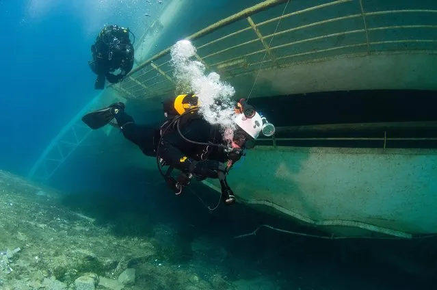A picture released by the Italian Carabinieri on 03 July 2014 shows Carabinieri divers inspecting the inside of the Costa Concordia cruise ship, at Giglio Island, Italy, in 2012. The Costa Concordia hit a reef and partly capsized on 13 January 2012, after being steered dangerously close to Giglio, in an alleged stunt by captain Francesco Schettino. Thirty-two of the 4,229 people onboard were killed. (Photo by EPA/Carabinieri Press Office)