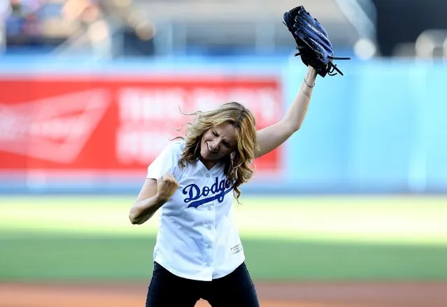 Actress Lea Thompson reacts after throwing out the first pitch before the game between the Cincinnati Reds and the Los Angeles Dodgers at Dodger Stadium on August 15, 2015 in Los Angeles, California, ahead of the after game showing of Back to Future on the stadium video boards. (Photo by Stephen Dunn/Getty Images)