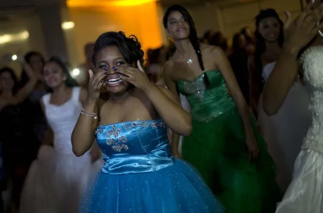 Jaqueline wipes away tears of joy during the ball. (Photo by Silvia Izquierdo/AP Photo via The Palm Beach Post)