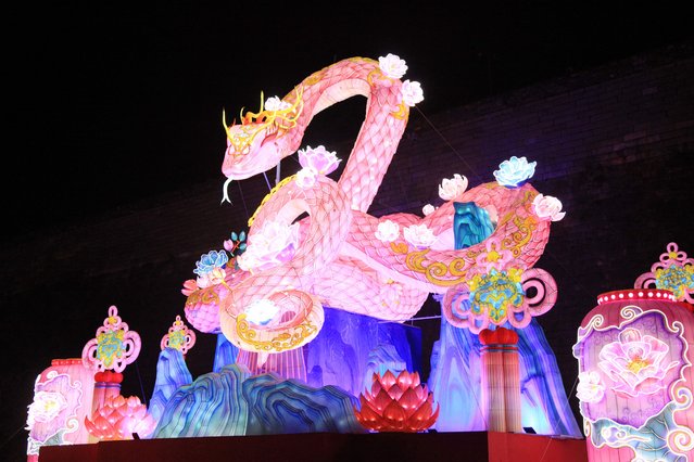 This photo taken on December 29, 2024 shows a serpent-shaped light installation in Nanjing, east China's Jiangsu province, to mark the coming Lunar New Year of the Snake which falls on January 29, 2025. (Photo by AFP Photo/China Stringer Network)