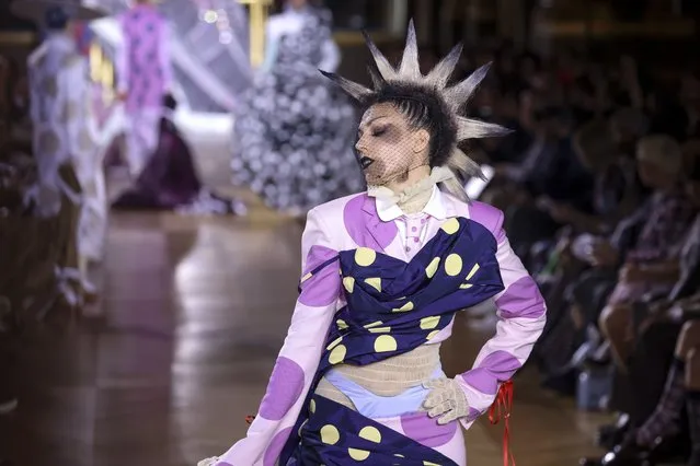 A model wears a creation for the Thom Browne ready-to-wear Spring/Summer 2023 fashion collection presented Monday, October 3, 2022 in Paris. (Photo by Vianney Le Caer/Invision/AP Photo)