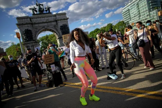 Demonstrators interact during a protest against racial inequality in the aftermath of the death in Minneapolis police custody of George Floyd, in front of the at Grand Army Plaza in the Brooklyn borough of New York City, New York, U.S. June 7, 2020. (Photo by Eduardo Munoz/Reuters)