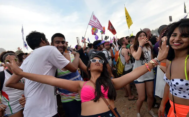 Marsha Shah (center), of Houston, Texas, dances to electronic beats at the TomorrowWorld electronic music festival in Chattahoochee Hills, South of Atlanta, on Saturday, September 27, 2014. The event has been the world's most popular electronic music festival in Europe for years. (Photo by Hyosub Shin/AJC)
