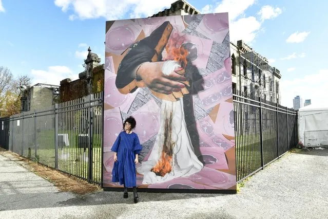 Sheida Soleimani poses in front of her artwork at Eyes on Iran Press Preview for Woman Life Freedom at Franklin D. Roosevelt Four Freedoms State Park on Roosevelt Island on November 28, 2022 in New York City. (Photo by Eugene Gologursky/Getty Images for WomanLifeFreedom.today)