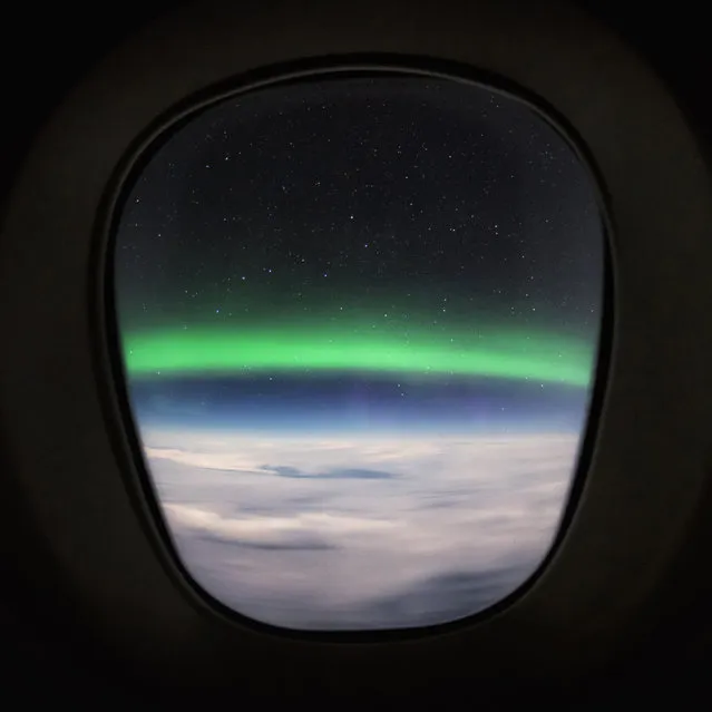 An Aurora seen from the window. (Photo by Christiaan van Heijst/Caters News Agency)