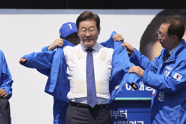 Lee Jae-myung, presidential candidate of the Democratic Party, wears a party jacket while campaigning in Seoul, South Korea, Monday, May 12, 2025. (Photo by Lee Jin-man/AP Photo)
