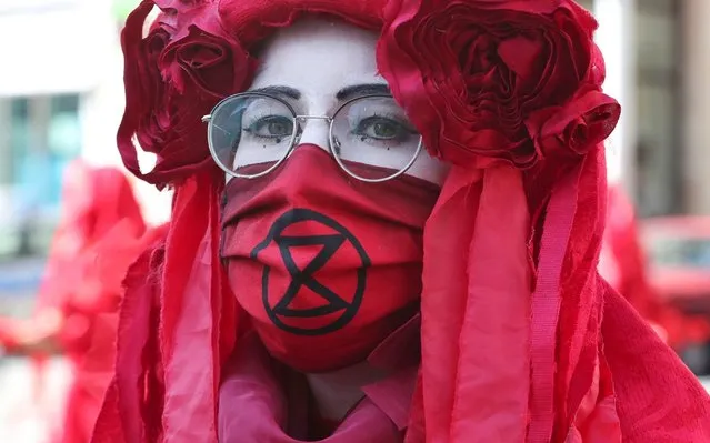 An activist from Extinction Rebellion takes part in the Great March for Climate, in Warsaw, Poland, Saturday, September 5, 2020. (Photo by Czarek Sokolowski/AP Photo)