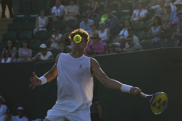 Ben Shelton of the U.S. returns the ball to Alex Bolt of Australia during their first round men's single match at the Wimbledon Tennis Championships in London, Tuesday, July 1, 2025. (Photo by Joanna Chan/AP Photo)