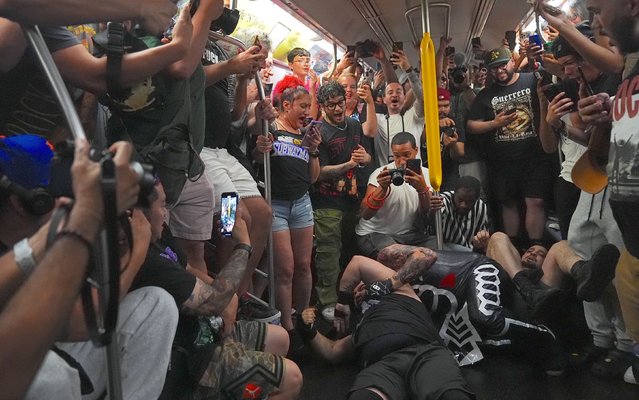 The crowd goes wild as a subway wrestling, Subway Mania takes the stage on the moving R train from 71st St./Forrest Hills, Queens to the 59th St./Lexington station in Manhattan on Sunday night, July 6, 2025 in New York City, United States. (Photo by Selcuk Acar/Anadolu via Getty Images)