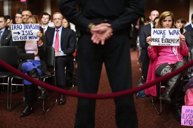 Members of Code Pink for Peace, including Medea Benjamin (L), silently protest as Defense Secretary Ashton Carter and Joint Chiefs of Staff Chairman Gen. Joseph Dunford Jr. testify before the Senate Armed Services Committee about the U.S. military strategy in the Middle East in the Dirksen Senate Office Building on Capitol Hill October 27, 2015 in Washington, DC. (Photo by Chip Somodevilla/Getty Images)
