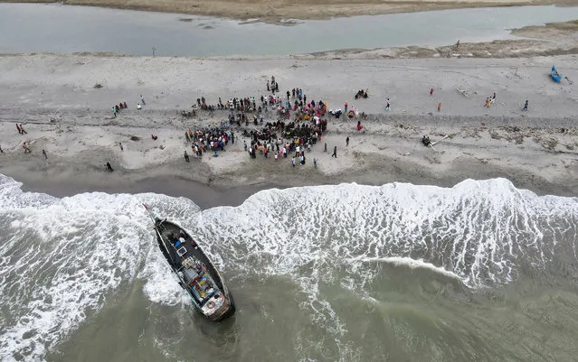 A boat carrying Rohingya Muslims is seen stranded at Lampanah beach, in Aceh province, Indonesia on February 16, 2023. (Photo by Hidayatullah Tajuddin/Reuters)