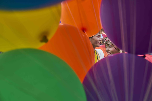 Participants are framed by a bouquet of of balloons before the start of the Pride Parade in Kathmandu, Nepal, August 10, 2025. (Photo by Niranjan Shrestha/AP Photo)