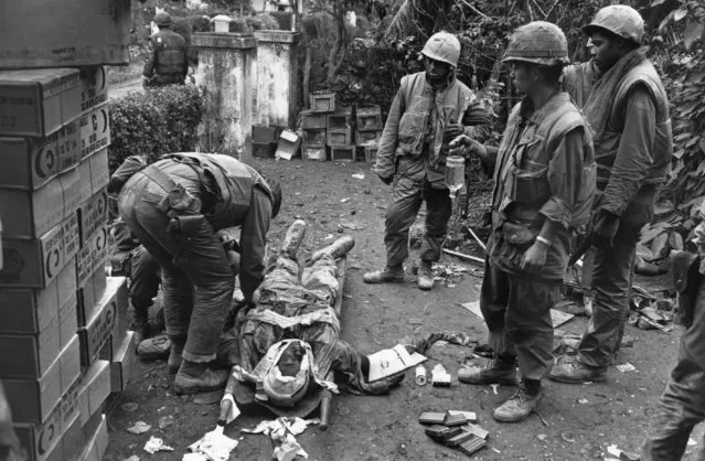 A wounded American soldier being attended to during the Vietnam war, 19th February 1968. (Photo by Terry Fincher/Daily Express/Hulton Archive/Getty Images)