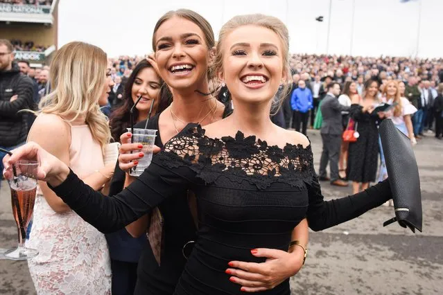 Racegoers attend day one of The Randox Health Grand National Festival at Aintree Racecourse on April 12, 2018 in Liverpool, England. (Photo by Mercury Press)