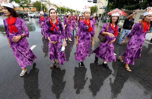 Thai workers wear costumes to resemble pregnant women as they march to mark International Workers' Day in Bangkok, Thailand, 01 May 2018. Thousands of Thai laborers rally on Labor Day calling on the government with a 10-point petition demanding for better welfare as well as improvement their work and living conditions. (Photo by Narong Sangnak/EPA/EFE)