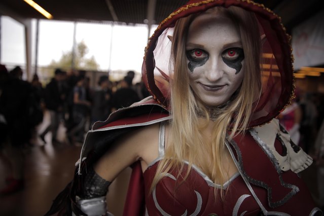 Sylvia, dressed as Sylvanas, a video game character of World Craft , poses at the Paris games week in Paris, France, Saturday, October 29, 2016. The Paris Games Week, or more commonly called “PGW” is the French show dedicated to video games and its derivatives. (Photo by Christophe Ena/AP Photo)
