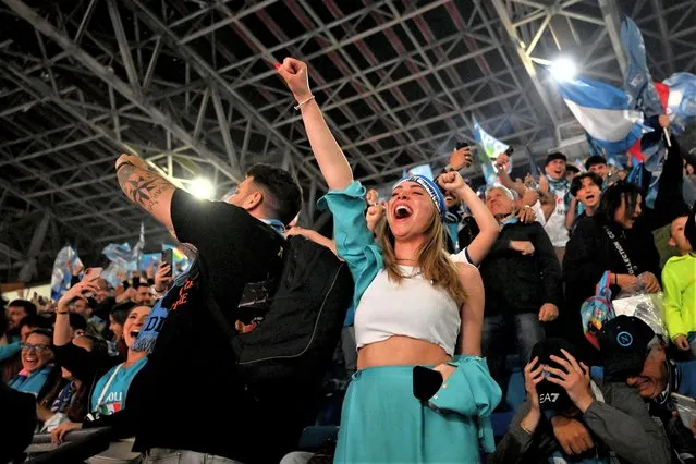 Fans of SSC Napoli celebrate their side winning the Serie A title after their side's draw in the Serie A match between Udinese Calcio and SSC Napoli at Stadio Diego Armando Maradona on May 04, 2023 in Naples, Italy. (Photo by Francesco Pecoraro/Getty Images)
