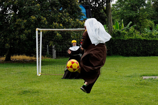 Poor Clare Sisters play soccer as they support the Colombian national team in the Copa America final against Argentina, at a convent in Montenegro, Colombia on July 13, 2024. (Photo by Vladimir Encina/Reuters)