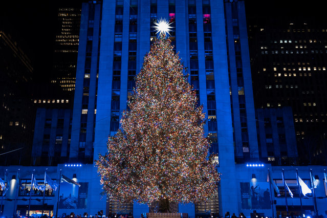 The Rockefeller Center Christmas tree after being lit during the 93rd annual Rockefeller Center Christmas tree lighting ceremony, Wednesday, December 3, 2025, in New York. (Photo by Yuki Iwamura/AP Photo)