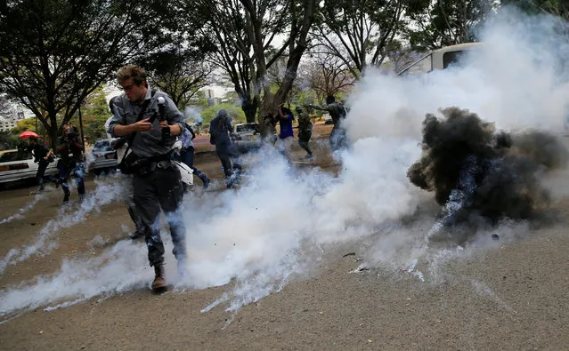 A tear-gas canister is fired towards journalists covering anti-corruption ptotest opposing the graft and abuse of funds in public healthcare, during a demonstration in Kenya's capital Nairobi, November 3, 2016. (Photo by Thomas Mukoya/Reuters)