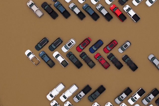 A drone view shows vehicles at an area flooded by the Green River, after multiple atmospheric rivers brought rain and flooding to the Pacific Northwest, in Kent, Washington, U.S., December 15, 2025. (Photo by David Ryder/Reuters)