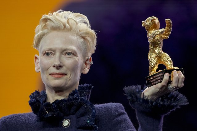 British actress Tilda Swinton holds the honorary Golden Bear for her life work during the opening of the International Film Festival, Berlinale, in Berlin, Thursday, February 13, 2025. (Photo by Markus Schreiber/AP Photo)