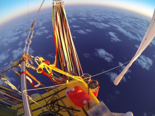 In Monday, January 26, 2015 photo provided by the Two Eagles Balloon Team, Troy Bradley of New Mexico and Leonid Tiukhtyaev of Russia set off from Saga, Japan, shortly before 6:30 a.m. JST Sunday, Jan. 25, 2015, in their quest to pilot their helium-filled balloon from Japan in a bid to reach North America and break two major records en route. in their quest to pilot their helium-filled balloon from Japan to North America and break two major records en route. (Photo by Troy Bradley/AP Photo/Two Eagles Balloon Team)