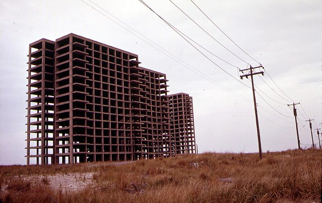 One of several highrise apartments whose construction was stopped by city ordinance to preserve the Breezy Point peninsula for public recreational use, in may of 1973. (Photo by Arthur Tress/NARA via The Atlantic)