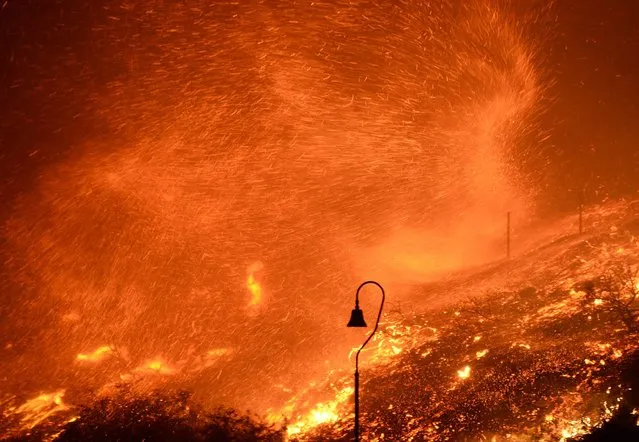 Strong winds kick up flying embers from the Solimar brush fire that started early Saturday morning in Ventura County, California December 26, 2015. (Photo by Gene Blevins/Reuters)