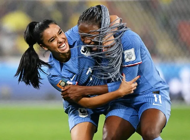 France's defender #07 Sakina Karchaoui (L) and France's forward #11 Kadidiatou Diani (R) celebrate their win at the end of the Australia and New Zealand 2023 Women's World Cup Group F football match between France and Brazil at Brisbane Stadium in Brisbane on July 29, 2023. (Photo by Dan Peled/Reuters)