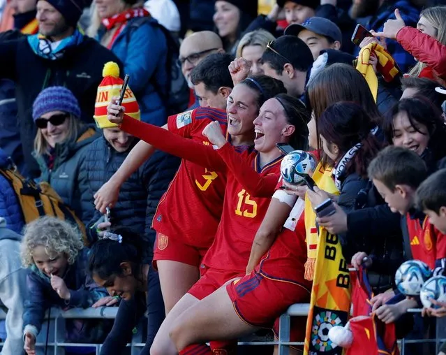 Spain's Teresa Abelleira and Eva Navarro celebrate with fans after quarter final match against Netherlands and progressing to the semi finals of the Women's World Cup, in Wellington, New Zealand on August 11, 2023. (Photo by Amanda Perobelli/Reuters)