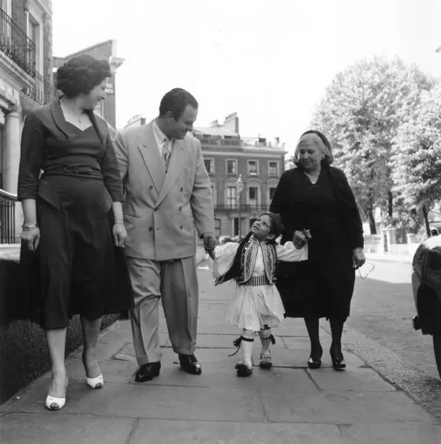 Three generations of the Constantinous, a Greek Cypriot family who live in Bayswater, London, 16th June 1956. The child is wearing the uniform of the Evzones, a Greek army regiment. (Photo by Bert Hardy/Picture Post/Getty Images)