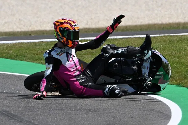 Angelus MTA's Spanish rider Ivan Ortola slides off the track during the second Moto3 class free practice session of the MotoGP Australian Grand Prix at Phillip Island on October 20, 2023. (Photo by Paul Crock/AFP Photo)