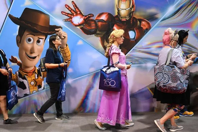 Fans wait in line to visit the D23 Expo Marketplace to buy merchandise during the Walt Disney D23 Expo in Anaheim, California on September 9, 2022 (Photo by Patrick T. Fallon/AFP Photo)